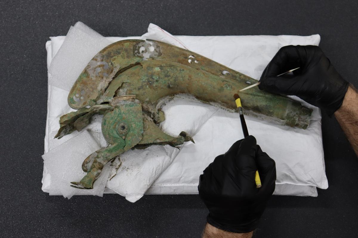 The bronze trumpet, which is shaped like a wild animal, would have been played by soldiers on the battlefield

Historic England