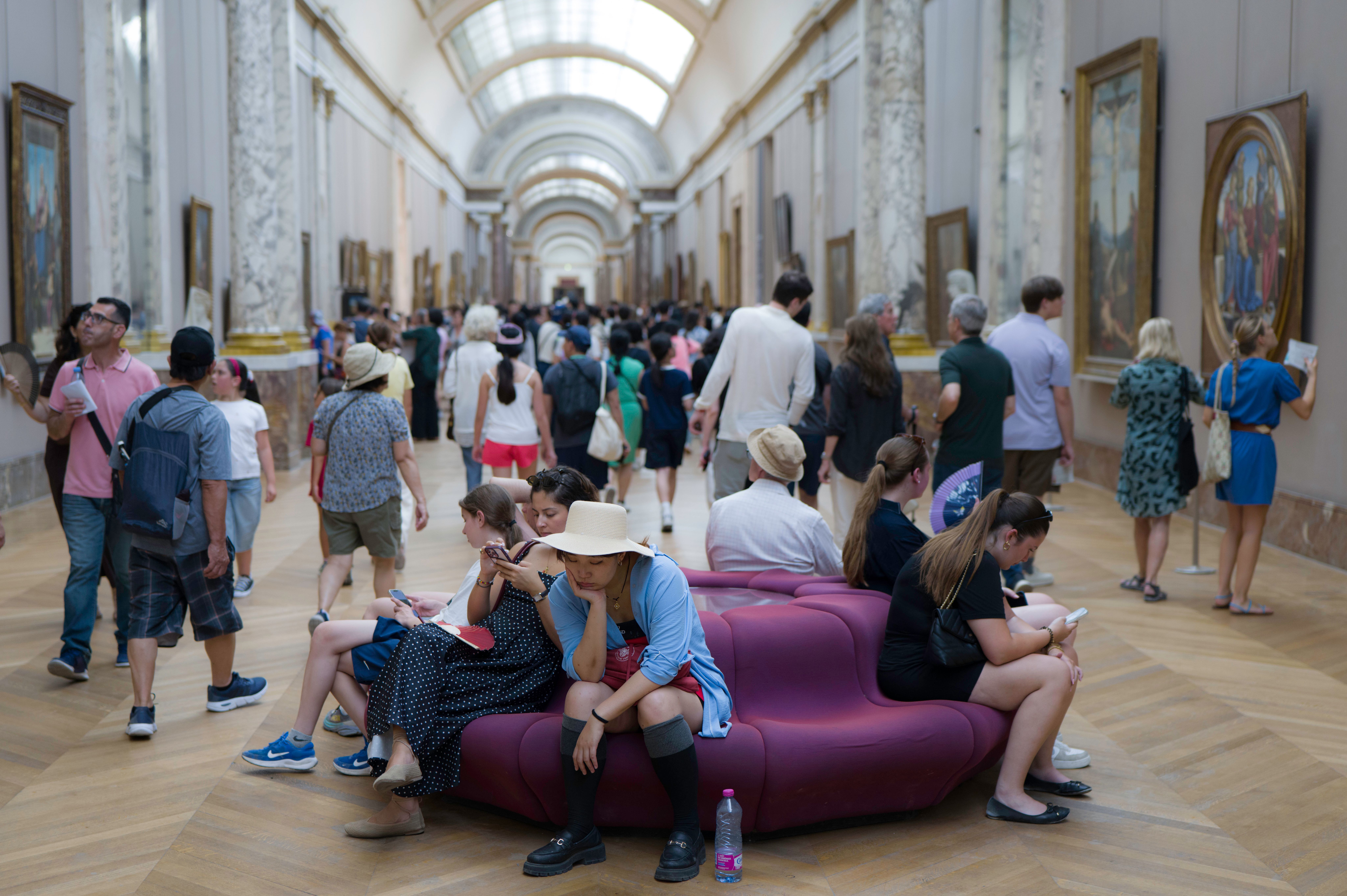 Visitors pause to rest in the Grand Gallery of the Louvre in Paris on 22 June 2026. Paris been placed on a red heatwave alert this week as temperatures have soared

Photo: Eric Broncard / Hans Lucas via Reuters Connect