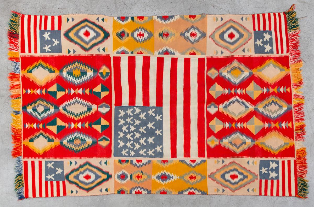 A unique example of a transitional-phase Navajo weaving in the "Germantown" tradition, with American flag panels and eye-dazzlers (1868-1910) by an unknown artist. Courtesy The Drawing Center.