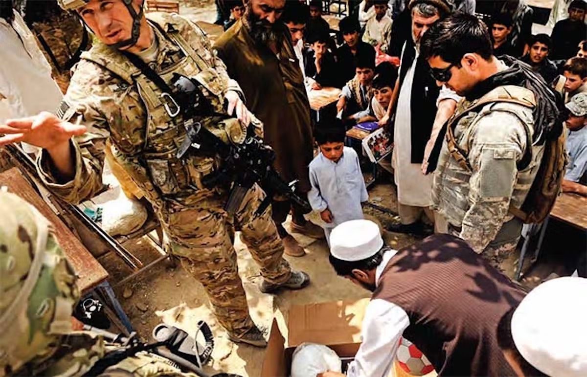 Lieutenant Colonel Andrew DeJesse (left), who is also an artist, is now on his second tour of Afghanistan, working with local communities to save heritage. Photo: US Air Force/Staff Sgt Ryan Crane