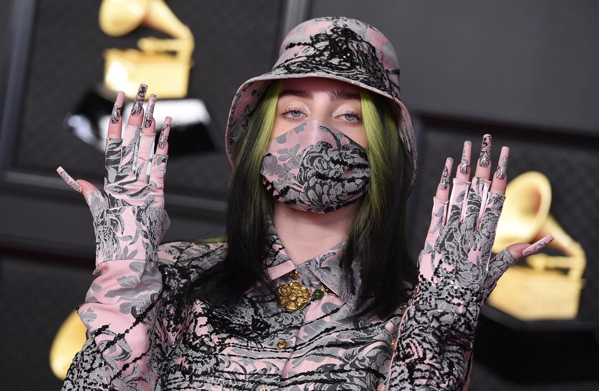 Met Gala co-host Billie Eilish arrived at the Grammy Awards in March wearing head to toe Gucci—including her face mask. Which designer will she choose for the Costume Institute fundraiser? Photo by Jordan Strauss/Invision/AP