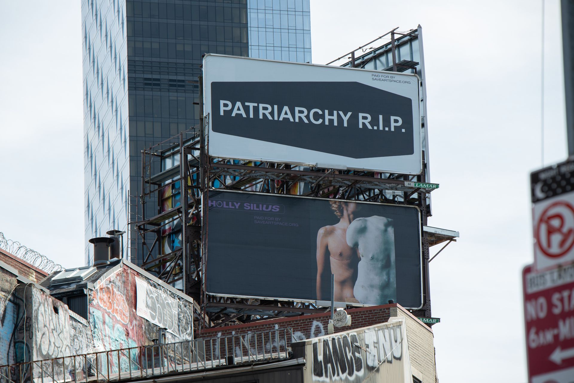 Billboards by Nadya Tolokonnikova (top) and Holly Silius (below) in Lower Manhattan as part of the SaveArtSpace exhibition Patriarchy RIP Photo by Scott Stanger