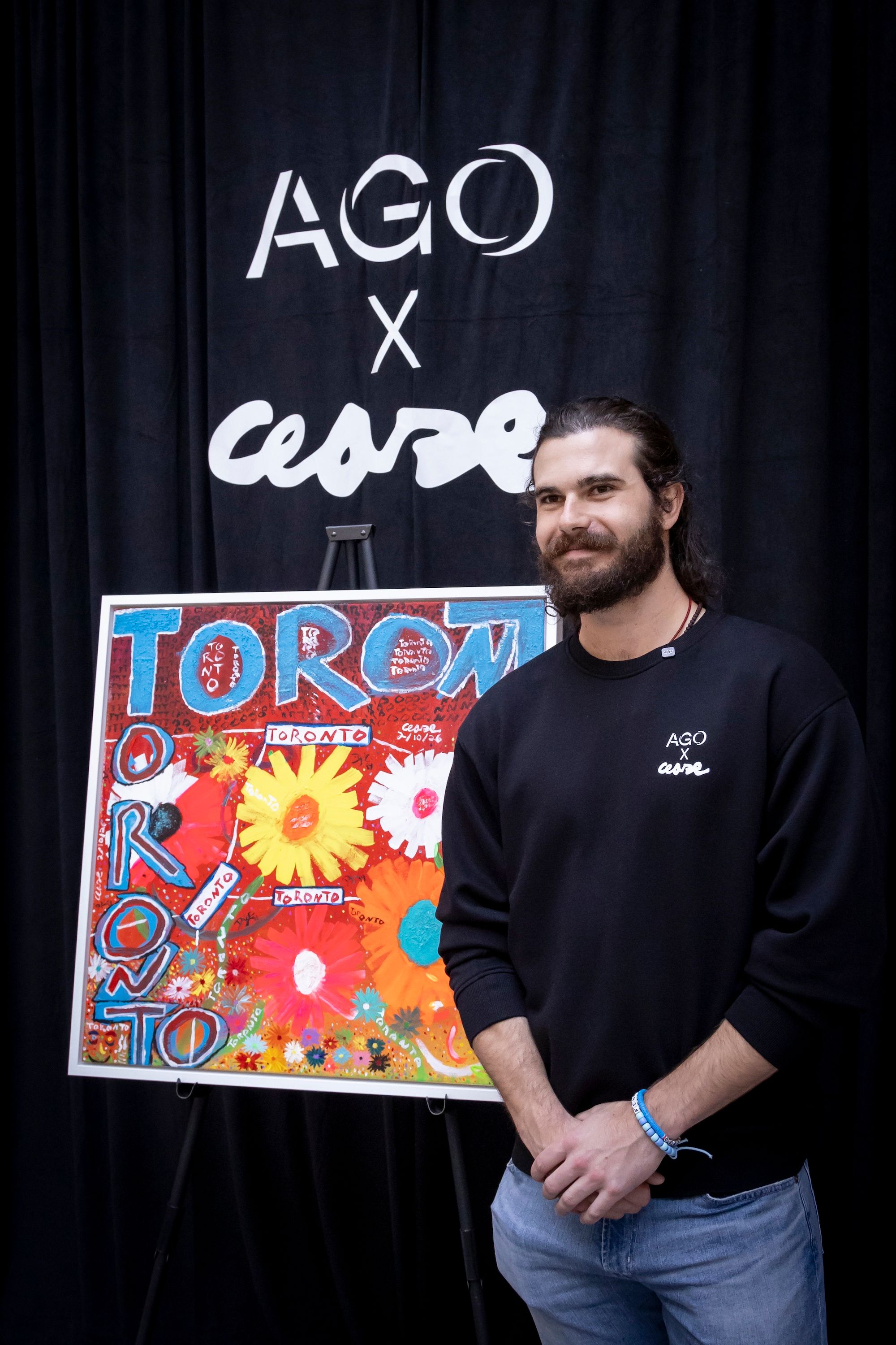 Dylan Cease next to his painting Eve of Toronto (2026) at the AGO x Cease event on 26 August Photo by Dean Tomlinson. © Art Gallery of Ontario
