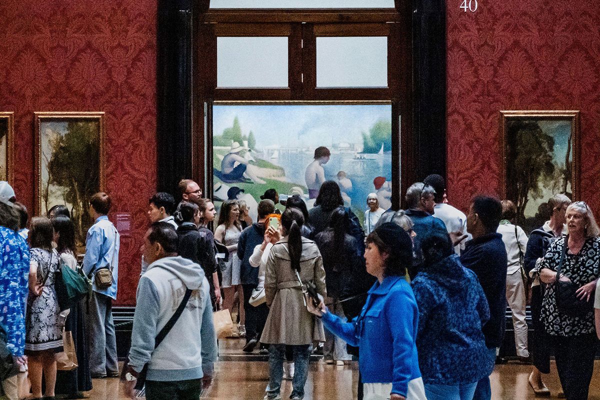 Crowds at the National Gallery in London following the unveiling of its collection rehang in May, with Georges Seurat's celebrated Bathers at Asnières (1884) in the background Guy Bell/Alamy Live News
