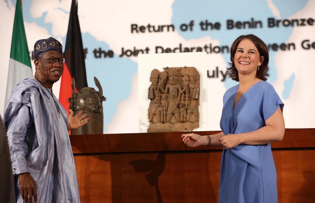 Layiwola Mohammed (left), Nigeria’s culture minister and Annalena Baerbock, the German foreign minister, sign an agreement of intent to return Benin Bronzes to the West African country. Germany was the first country to hand back artefacts looted by the British in 1897 Adam Berry/AFP via Getty Images
