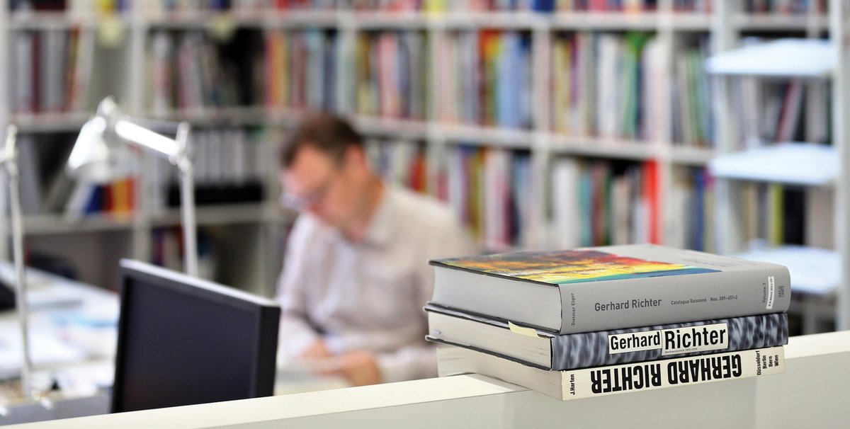 Employees of the Gerhard Richter Archive in Dresden, Germany. The archive’s premises are currently too small to hold the numerous publications on the 81-year-old artist, so the team are considering a digital solution © Jan Woitas, courtesy DPA Picture Alliance/Alamy