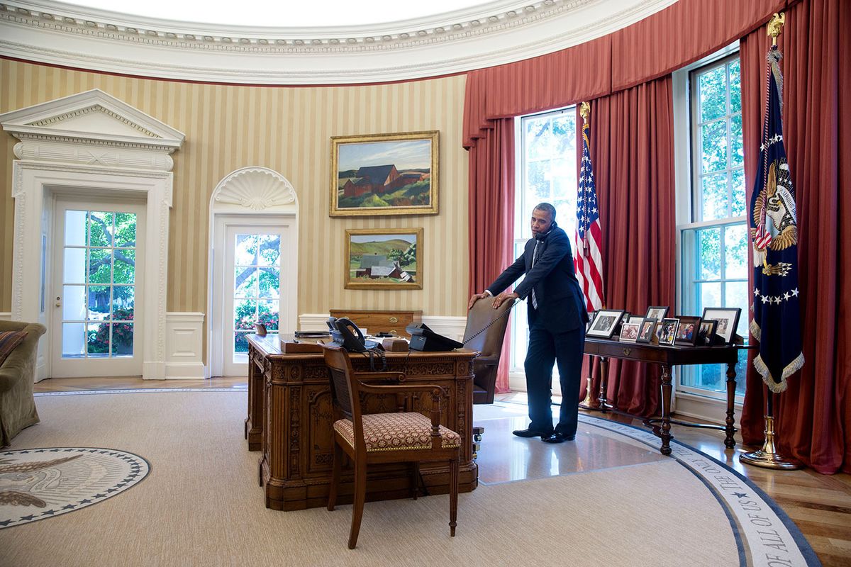 Pride of place: the Whitney is deaccessioning Edward Hopper’s Cobb’s Barns, South Truro, shown here on the wall of the Oval Office above his Burly Cobb’s House, South Truro—both works were temporarily loaned to the White House during Barack Obama’s presidency Photo by Pete Souza