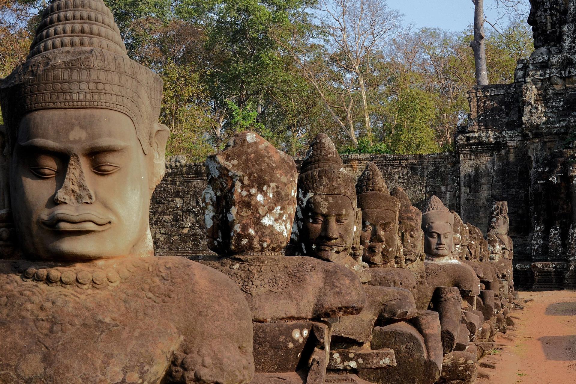 Sculptures of deities on a bridge to the south gate of Angkor Thom, Cambodia, where many of the heads have been replaced with copies because the originals have been stolen Photo: Zeitmesser