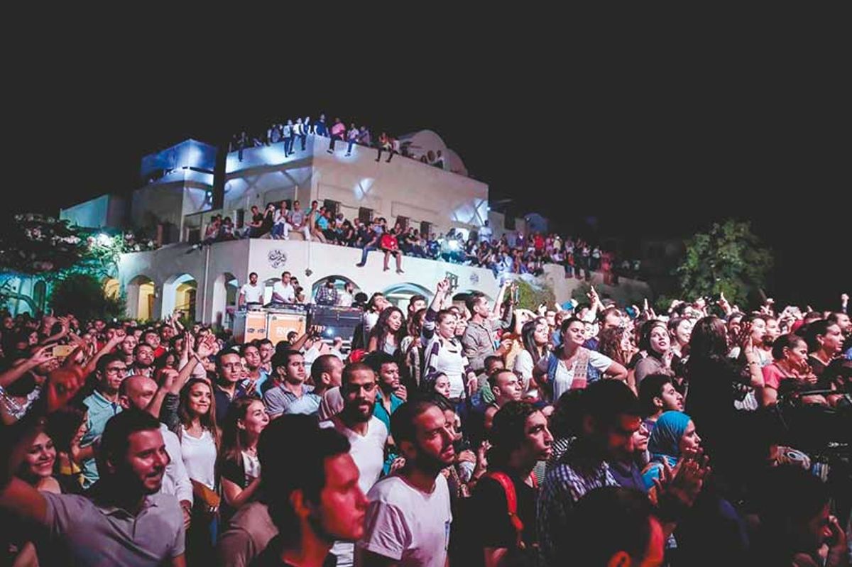 Crowds at an event at the Darb 1718 cultural centre. The venue is among several sites in Cairo’s historic Fustat area that are at risk of destruction

© Darb 1718
