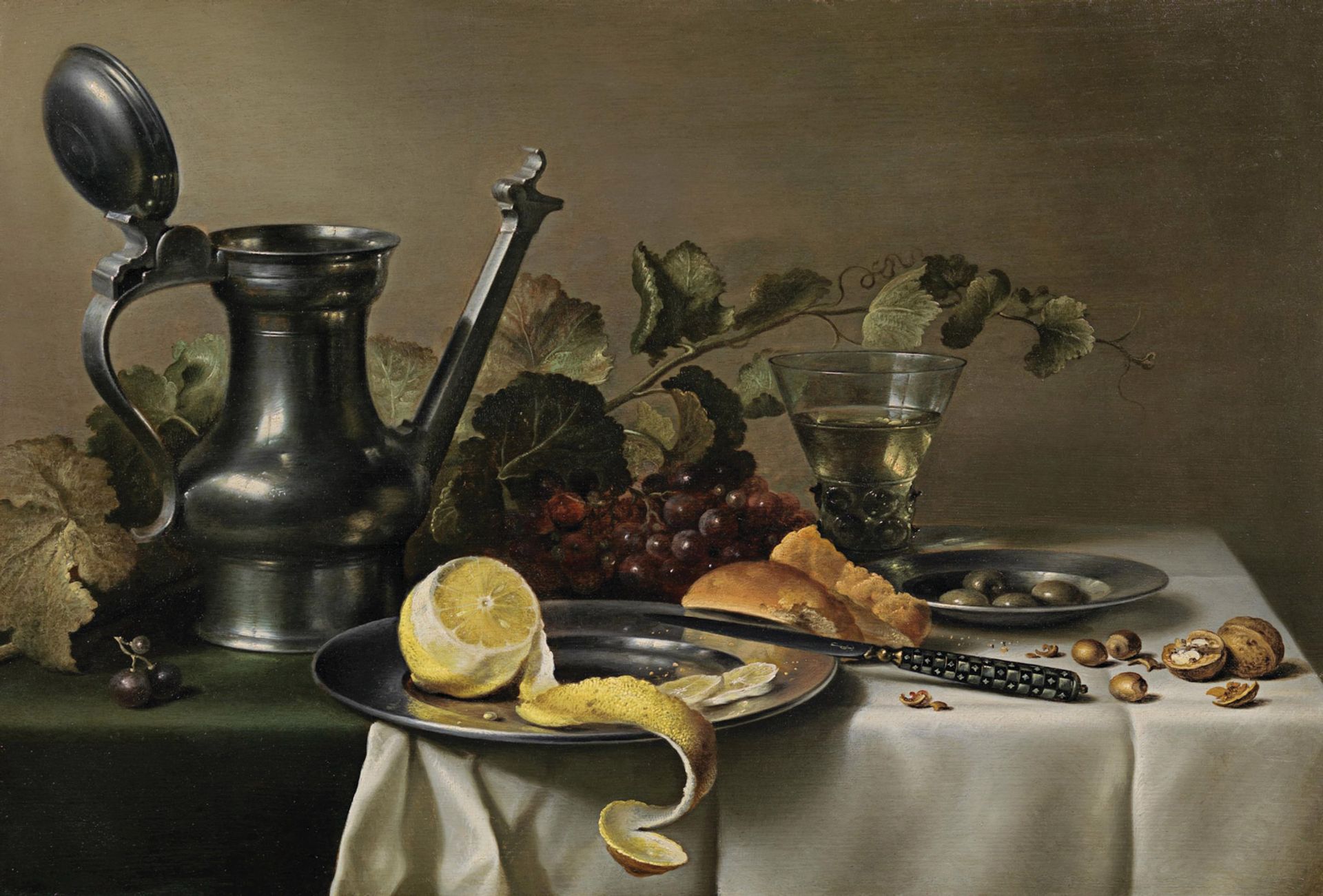 Pieter Claesz’s Still life with a pewter jug, a peeled lemon on a pewter plate, bread, a knife, a berkemeyer and vine leaves on a table partly draped with a white cloth (around 1632) is priced at £1.3m at Richard Green. Courtesy of Richard Green Gallery