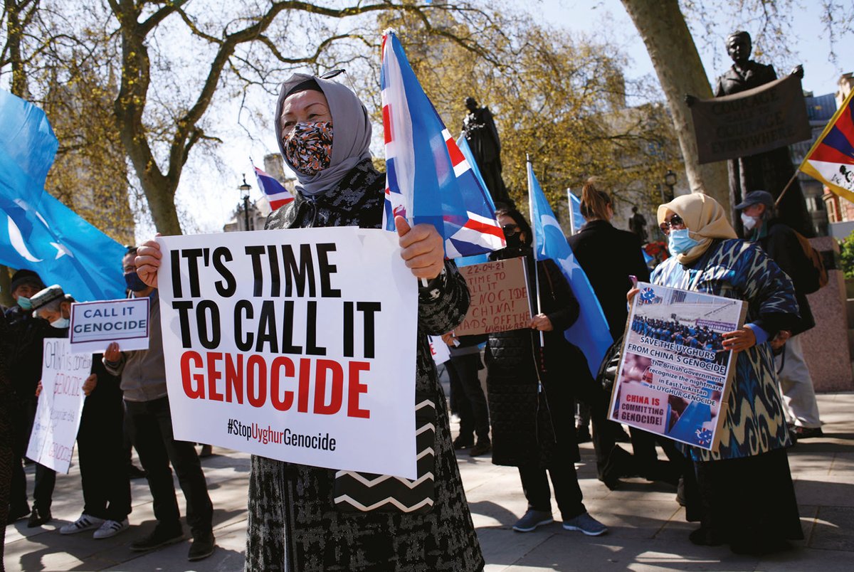 Members of the Uyghur community and human rights activists demonstrate outside the UK Houses of Parliament Photo: David Cliff/Anadolu Agency via Getty Images