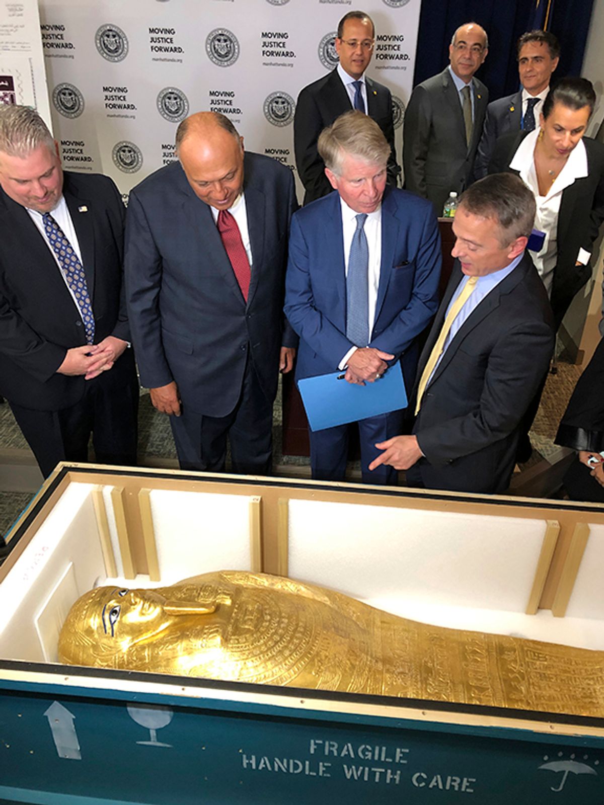 From left in foreground, US Homeland Security Investigations special-agent-in-charge Peter C. Fitzhugh; the Egyptian minister of foreign affairs, Sameh Hassan Shoukry; Manhattan District Attorney Cyrus R. Vance Jr.; and Assistant District Attorney Matthew Bogdanos witness the handover of an ancient Egyptian coffin at a repatriation ceremony in New York AP Photo/Michael R. Sisak