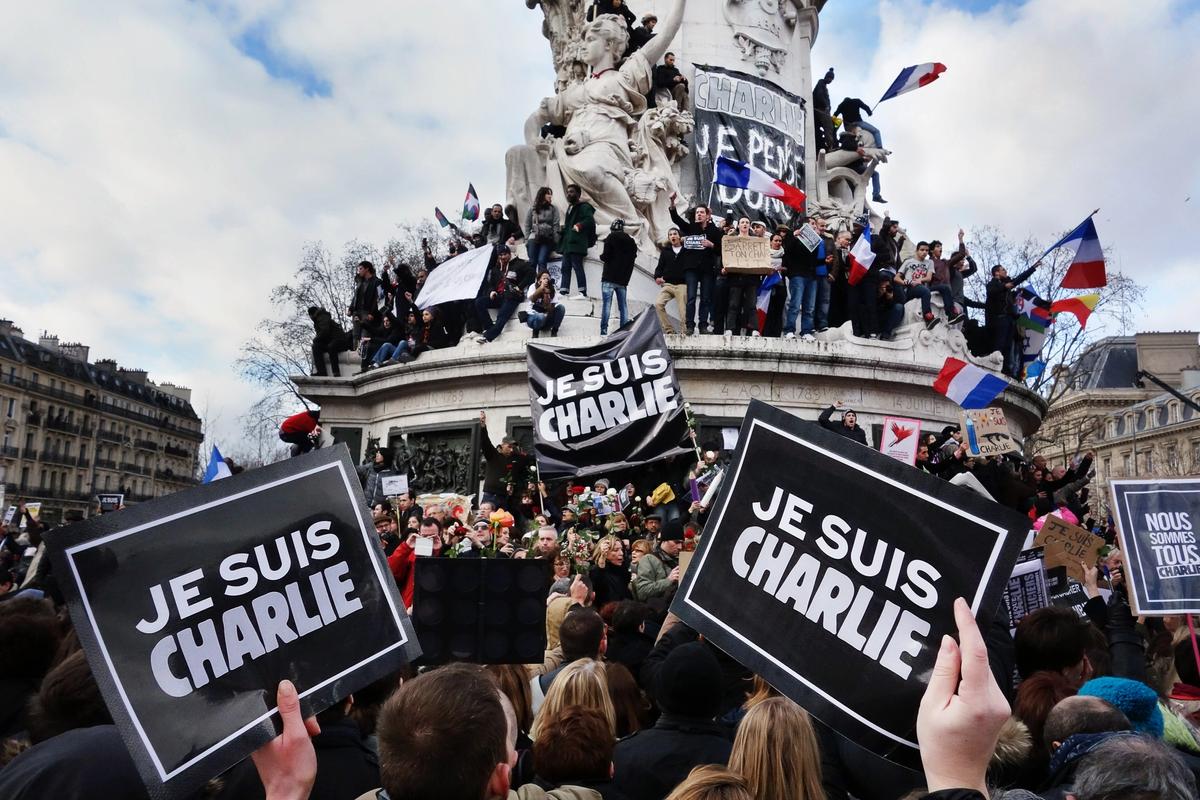 People in Paris gathered in support of the victims of the Charlie Hebdo shooting in 2015 Photo: Olivier Ortelpa