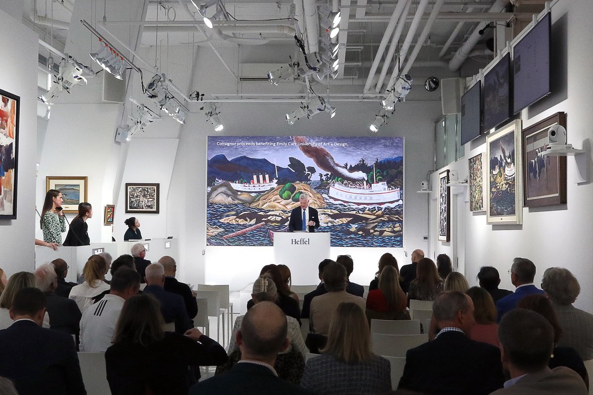 Heffel vice president Robert Heffel fields bids for E.J. Hughes's Coastal Boats Near Sidney, BC during Thursday's auction Courtesy Heffel