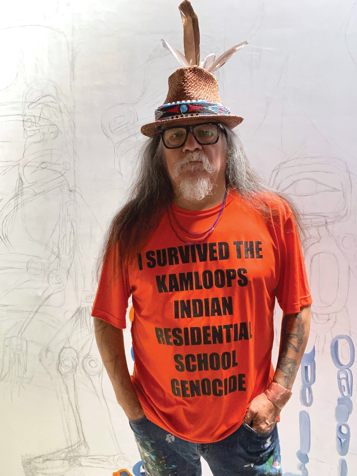 Lawrence Paul Yuxweluptun, a Cowichan/Syilx artist based in Vancouver, in front of his painting Spirit Child Walking Home Courtesy of Macaulay & Co. Fine Art and the artist