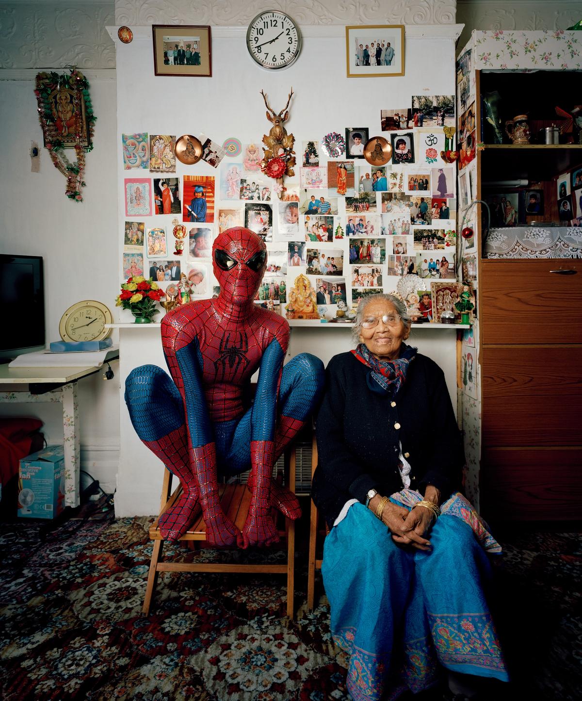 Hetain Patel, dressed in one of his Spider-Man outfits, beside his grandmother Laxmiben, in Baa’s House (2015) © Hetain Patel