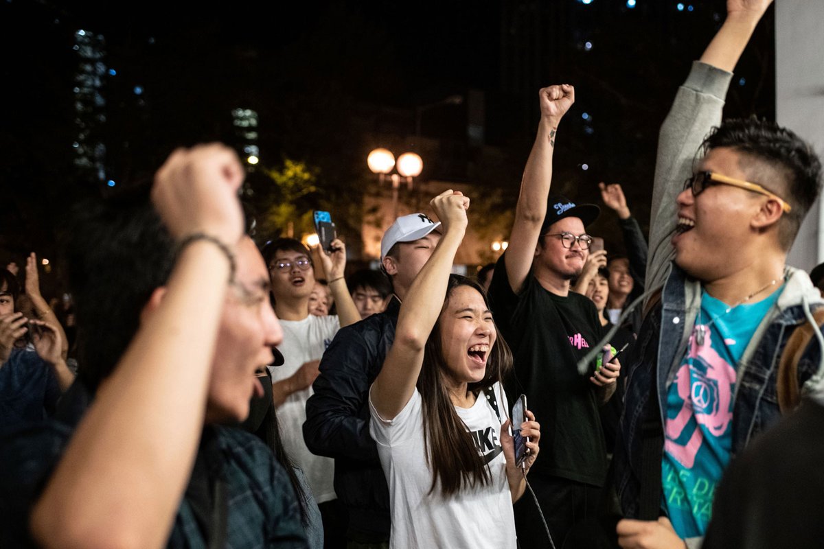 Pro-democracy supporters celebrate after a landslide win in Hong Kong's council elections in ©  Philip Fong / AFP via Getty Images