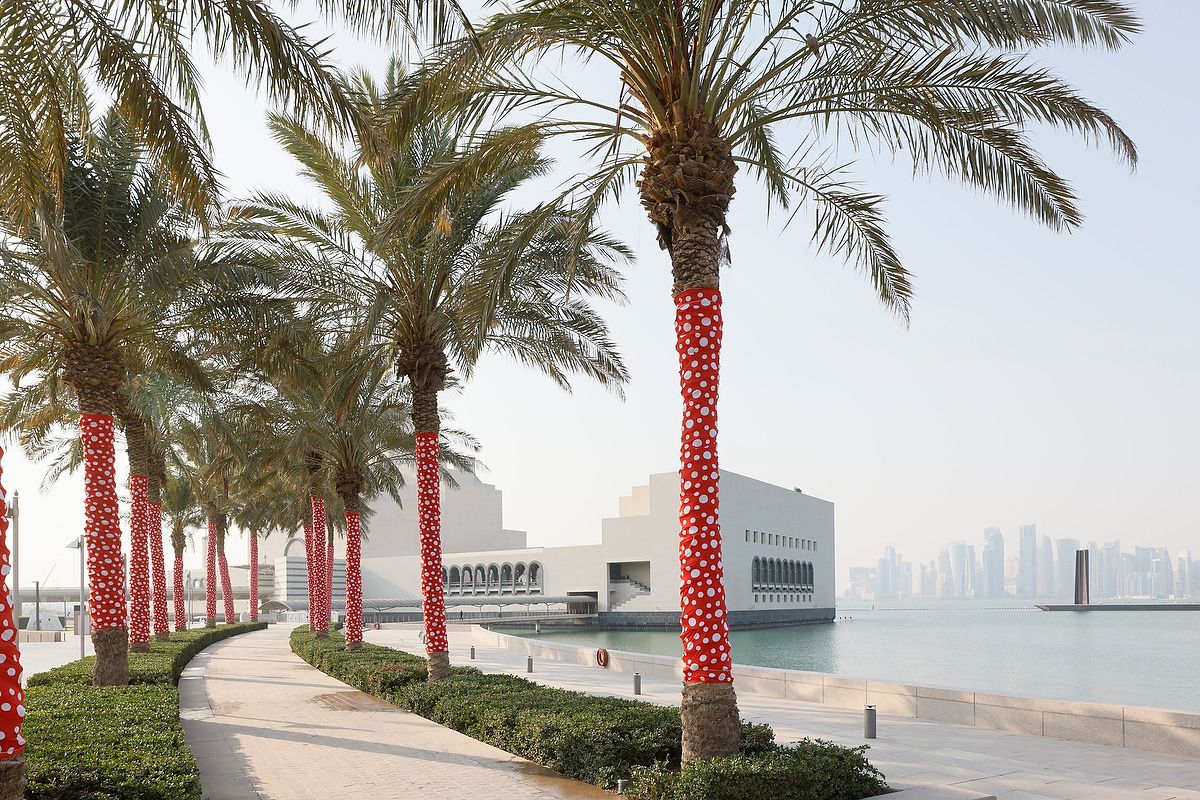 Yayoi Kusama's Ascension of Polka Dots on the Trees (2002/2022) Installation view, My Soul Blooms Forever, Museum of Islamic Art, Doha, Qatar. Photo by Iwan Baan. Artwork © YAYOI KUSAMA. Courtesy David Zwirner, Ota Fine Arts, and Victoria Miro