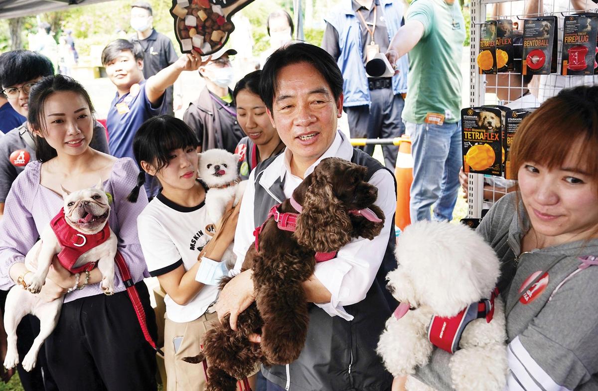 Pet project: Lai Ching-te, the candidate for the incumbent Democratic Progressive Party, on the campaign trail in Taipei Associated Press/Alamy Stock Photo