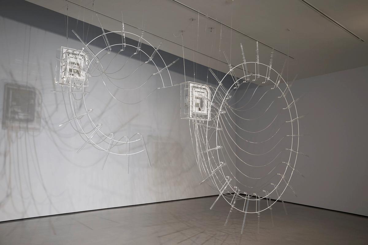 Cerith Wyn Evans, Composition for 37 flutes (in two parts), (2018), 37 crystal glass flutes, ‘breathing’ unit and valve system, plastic tubes Photo: Stuart Whipps