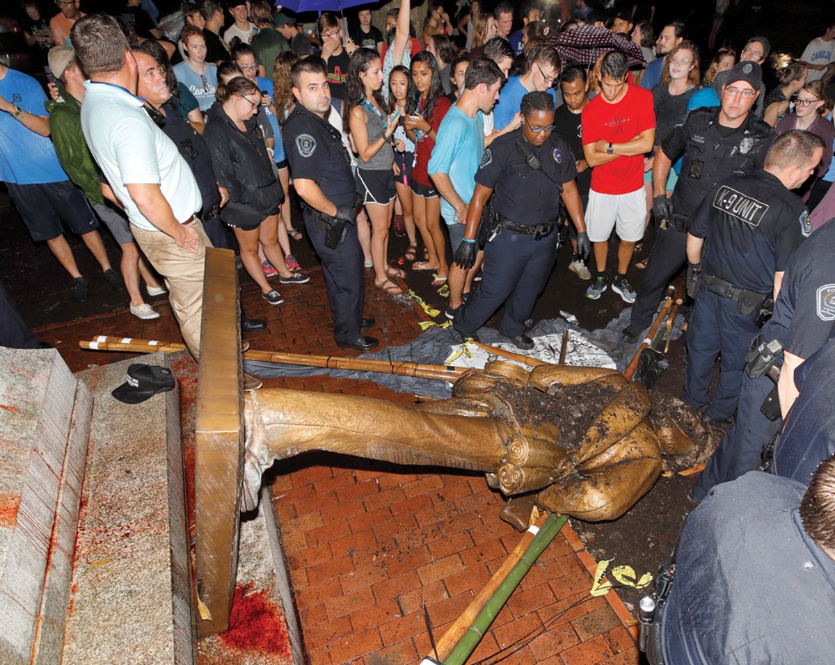 The statue of a gun-toting Confederate soldier at Chapel Hill, nicknamed Silent Sam, was toppled by protestors in August © Reuters/Jonathan Drake