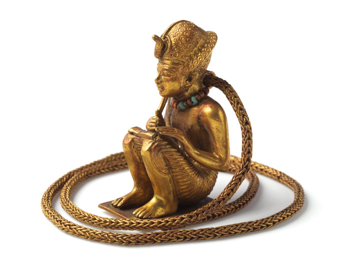 This gold squatting figure (1336-1326BC) with chain was previously thought to be a depiction of Amenhotep III © Brooklyn Museum