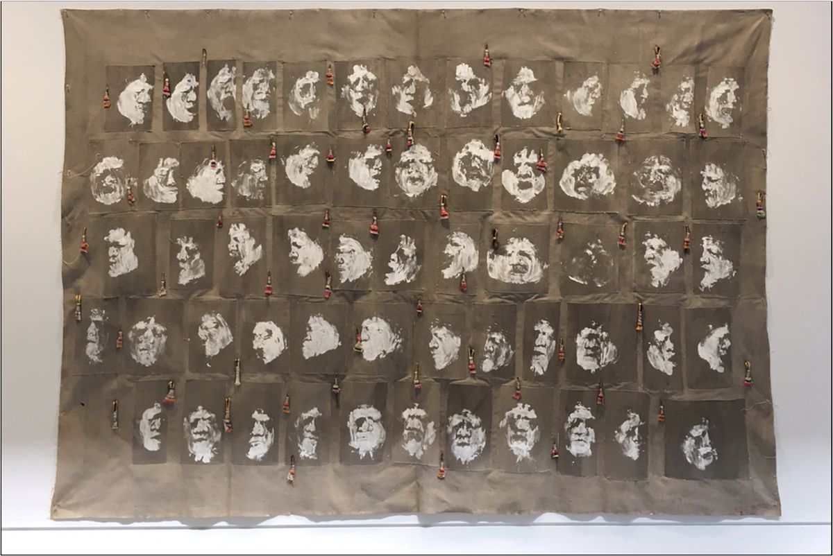 Carlos Villa, First Impression, 1981, bones, hair, rags and Stuc-O-Life paint (latex with silica, quartz, sand and fossil remains) on raw unstretched canvas on stretcher Asian Art Museum of San Francisco, Museum purchase, 2020. ©Mary Valledor, Estate of Carlos Villa.