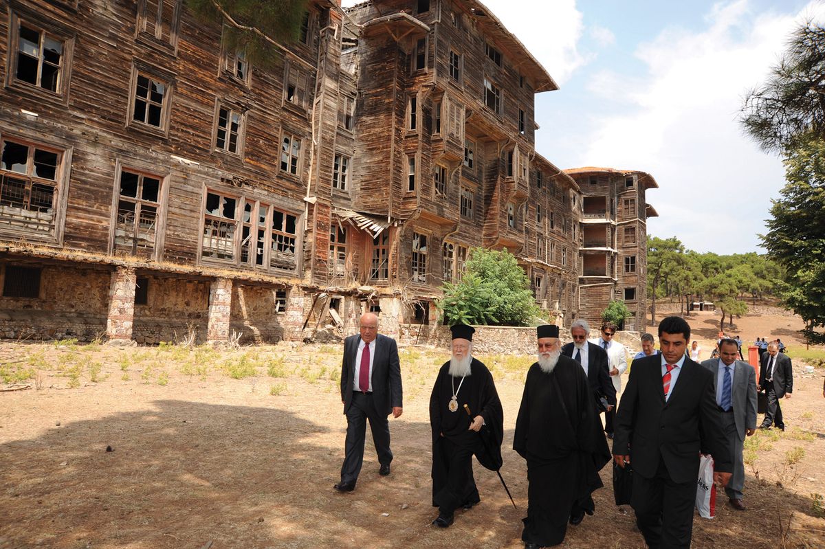 A group including the spiritual leader of Orthodox Christians, Patriarch Bartholomew, visits the dilapidated Prinkipo Orphanage. Turkey was ordered to return the site to the Ecumenical Patriarchate in a 2010 ruling by the European Court of Human Rights Photo: Nikolaos Manginas