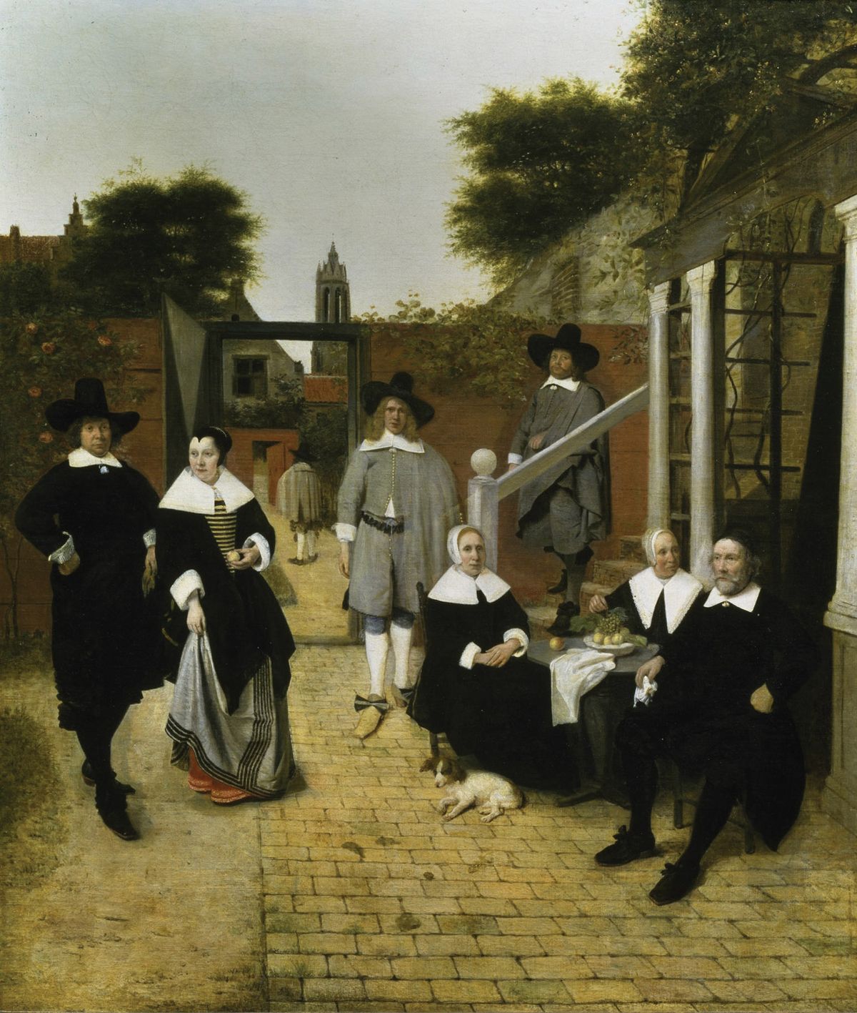 Delft’s Nieuwe Kerk can be seen in the background of De Hooch’s Portrait of a Family at a Courtyard in Delft (around 1657-60) © Gemäldegalerie der Akademie der bildende Künste Vienna