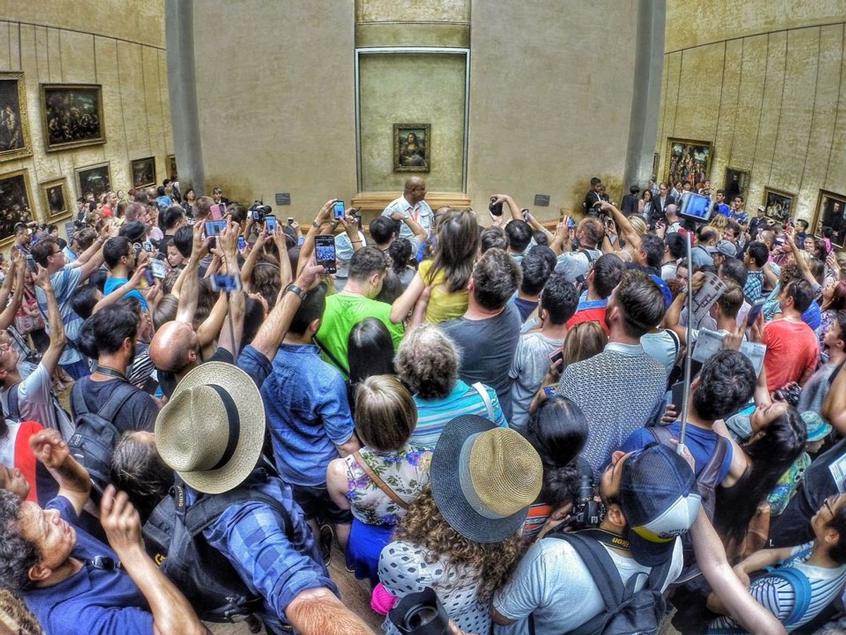 Packing them in? Crowds jostle to see the Mona Lisa at the Louvre Photo: Max Fercondini