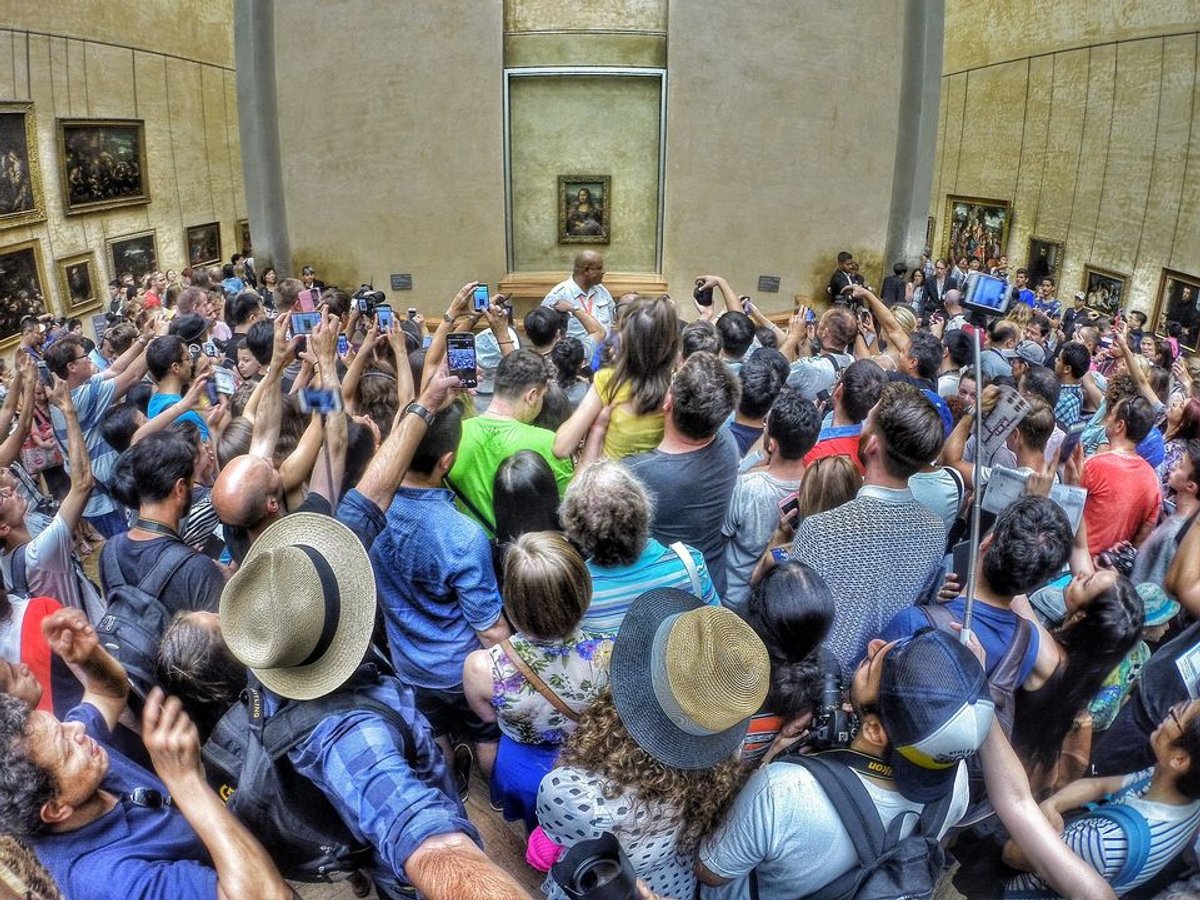 Packing them in? Crowds jostle to see the Mona Lisa at the Louvre Photo: Max Fercondini