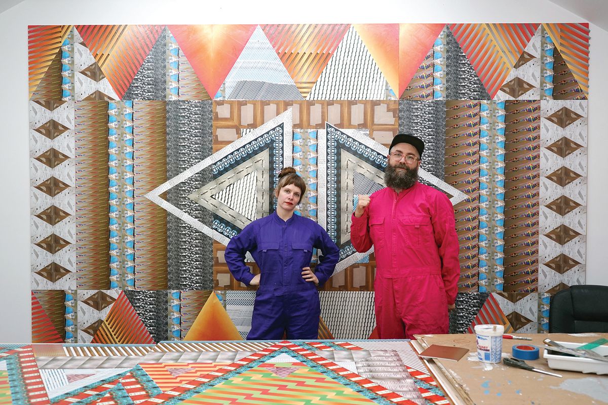 Ghost of a Dream artist duo, Lauren Was and Adam Eckstrom, preparing their site-specific installation, Yesterday Is Here in the lobby of Boston’s MassArt Art Museum Courtesy of MassArt