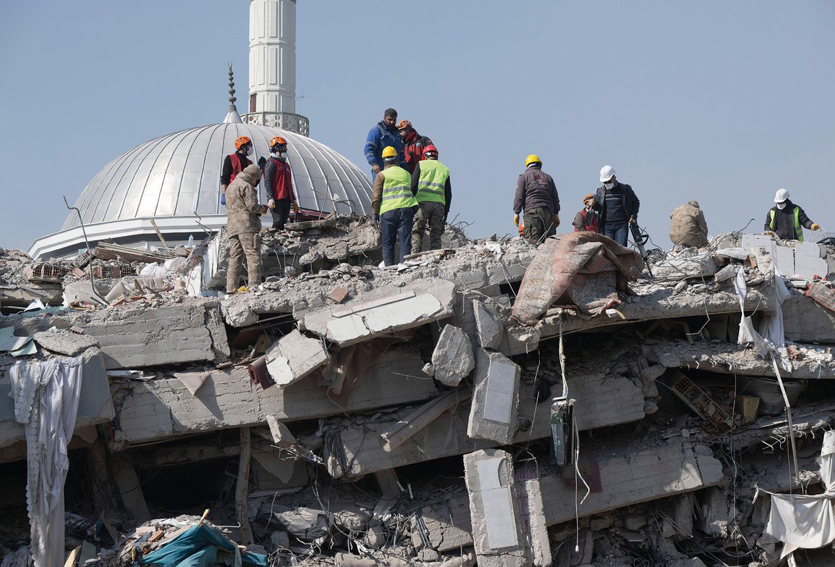 Volunteers and workers search for survivors in the town of Kahramanmaraş. A year on from the earthquake, reconstruction of historic sites is just beginning dpa picture alliance/Alamy Stock Photo