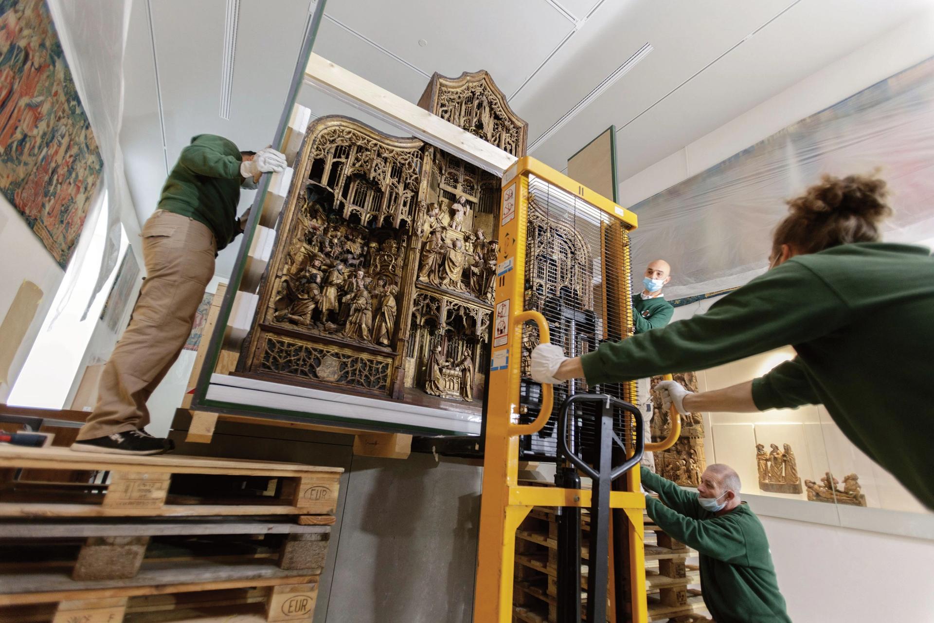 Workers move an altarpiece into place in one of the newly renovated galleries at the Musée de Cluny. Around 500 works from the museum’s collection have been restored in time for the reopening © Michel Bourguet/Musée de Cluny