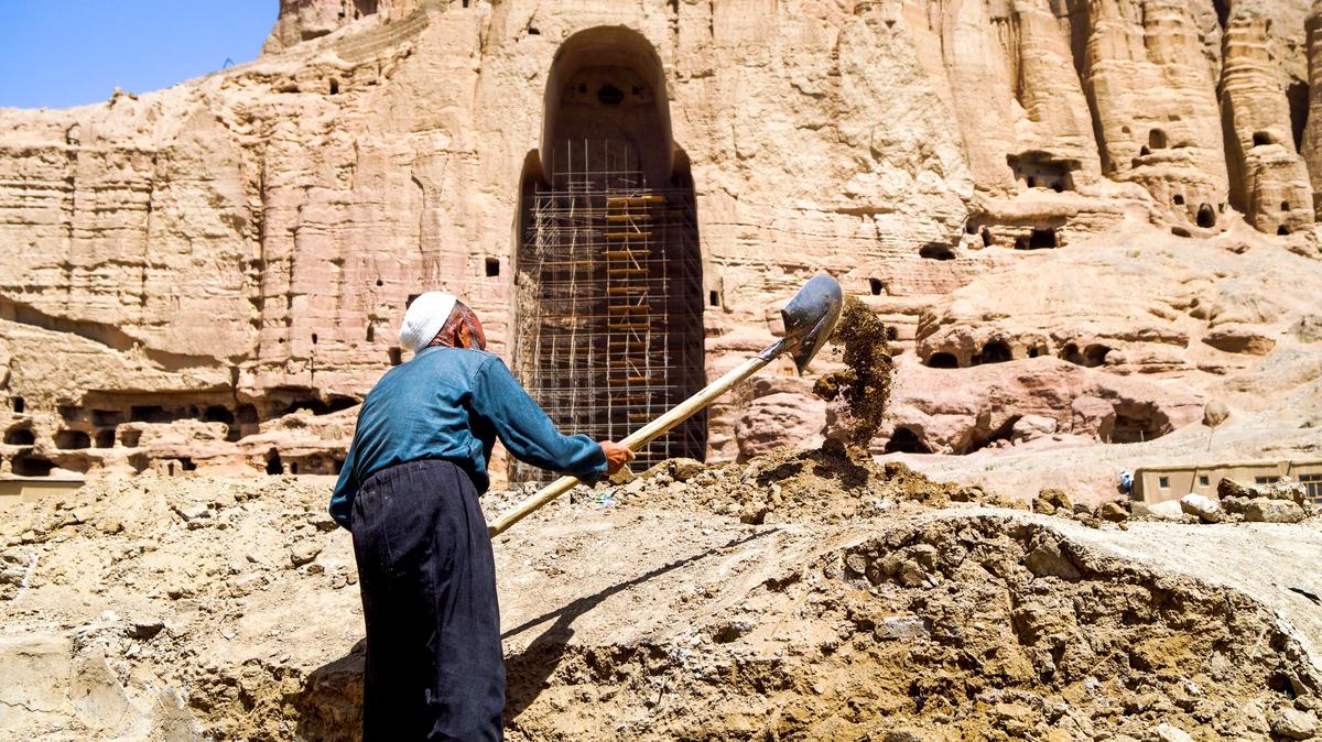 A labourer digging grounds near the Western Buddha niche at the inauguration ceremony on 1 August that announced plans to rebuild an old bazaar in Bamiyan Valley. The works were stopped the next day. © The Art Newspaper