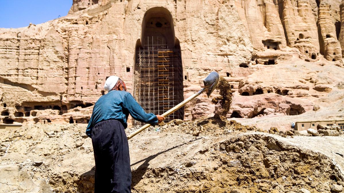 A labourer digging grounds near the Western Buddha niche at the inauguration ceremony on 1 August that announced plans to rebuild an old bazaar in Bamiyan Valley. The works were stopped the next day. © The Art Newspaper