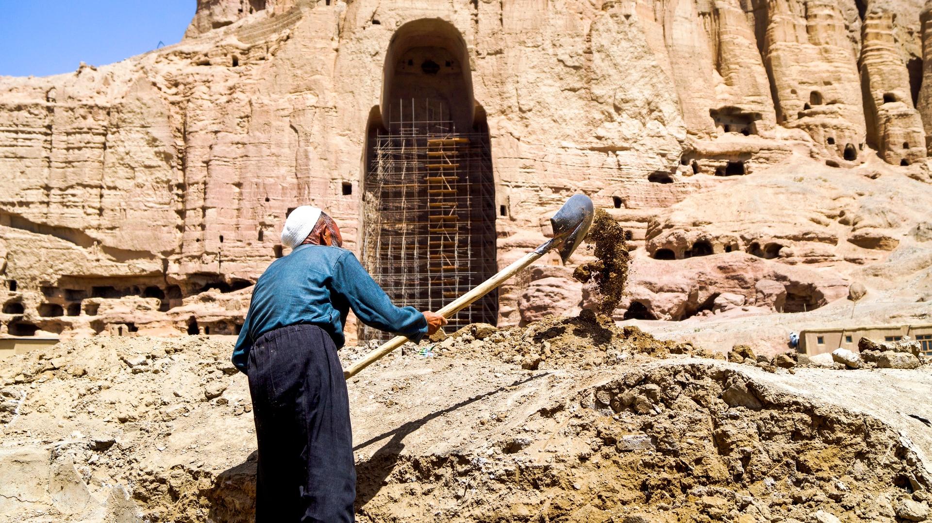 A labourer digging grounds near the Western Buddha niche at the inauguration ceremony on 1 August that announced plans to rebuild an old bazaar in Bamiyan Valley. The works were stopped the next day. © The Art Newspaper