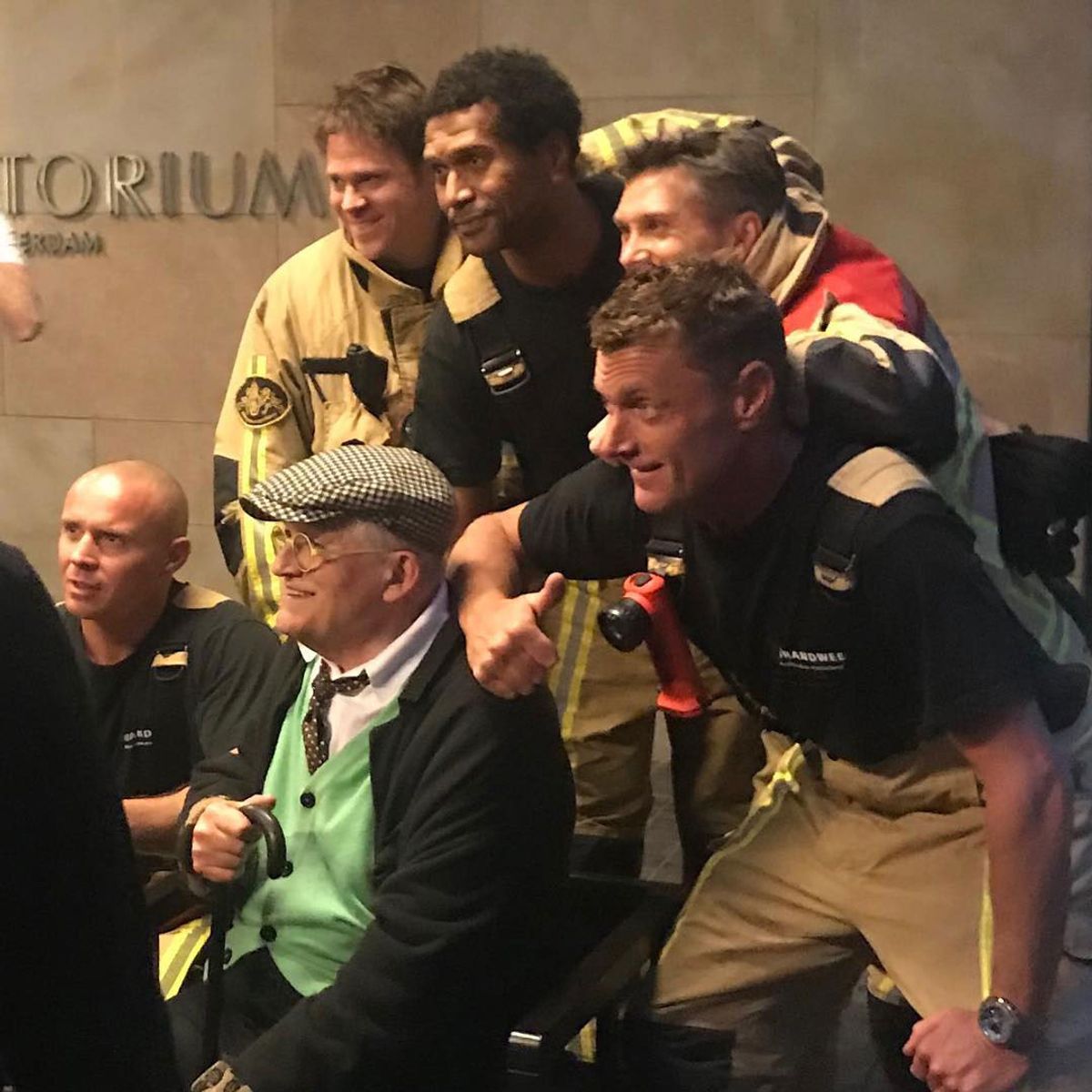 David Hockney with the Dutch firemen who rescued him from a lift in Amsterdam © davidelidawson/Instagram