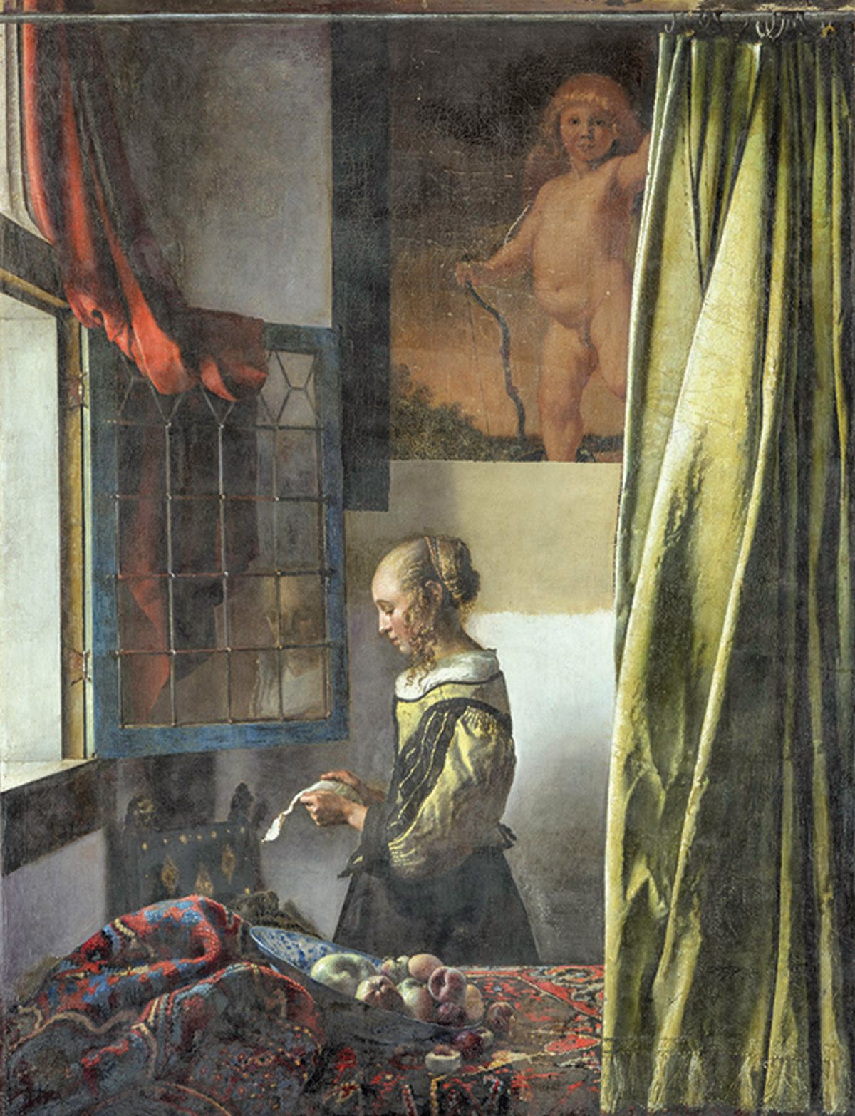 Vermeer’s Girl Reading a Letter at an Open Window (1657-59) photographed during its four-year transformation, during which overpaint was removed from the back wall to reveal a picture of Cupid Photo: Wolfgang Kreische; © SKD