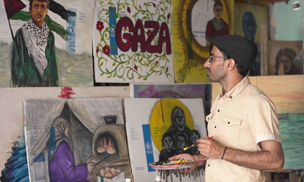 'I'm sending a piece of Gaza to the world': Palestinian artist Ahmed Muhanna discusses his exhibition of works painted on aid boxes
