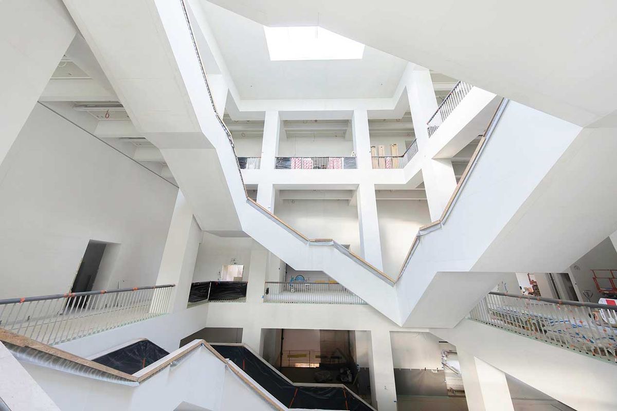 The exhibition spaces in the MSN Warsaw’s new building, totalling around 48,000 sq. ft, are arranged around a glass-roofed atrium with a dramatic staircase 

Photo: Marta Ejsmont; courtesy of MSN Warsaw