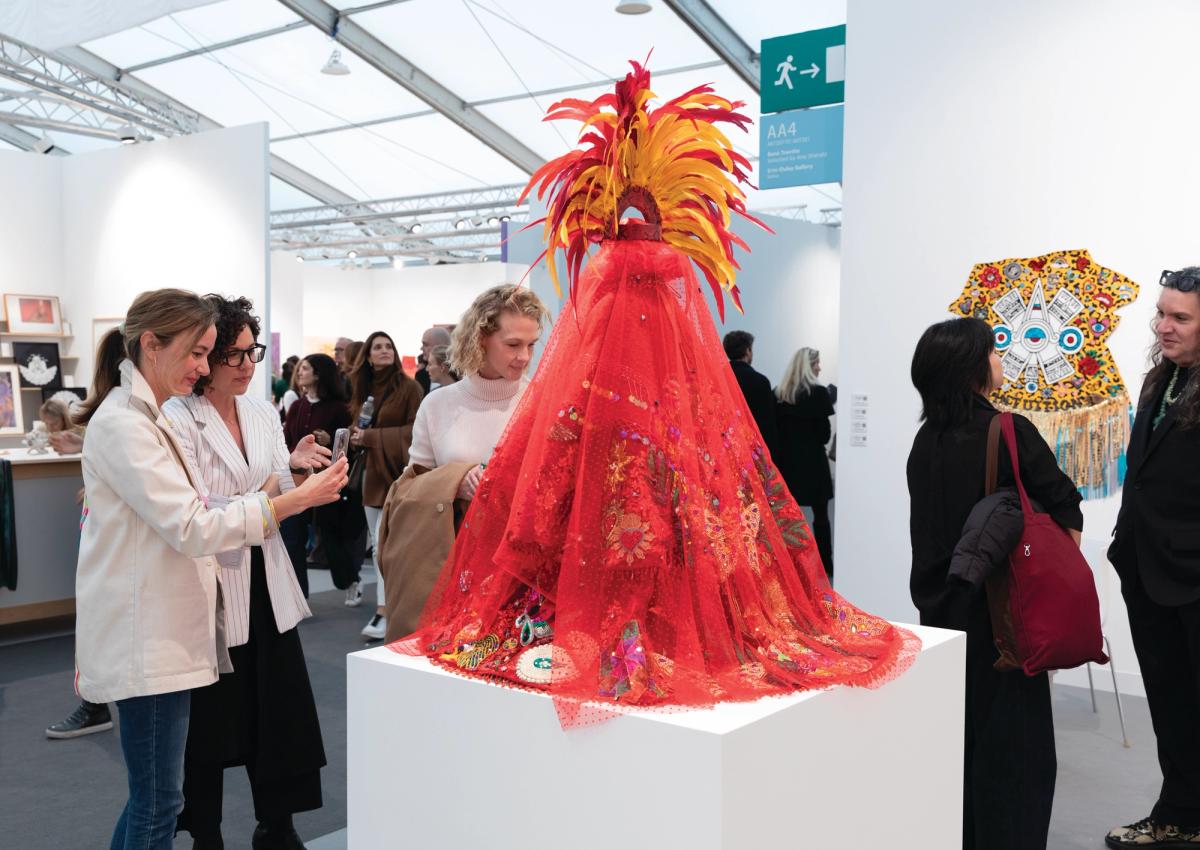 René Treviño's Regalia, Moscas Brillantes (Rojo) (2025), the centrepiece of his solo presentation at Frieze London, is adorned with red feathers, lace and rhinestones

Photo © David Owens