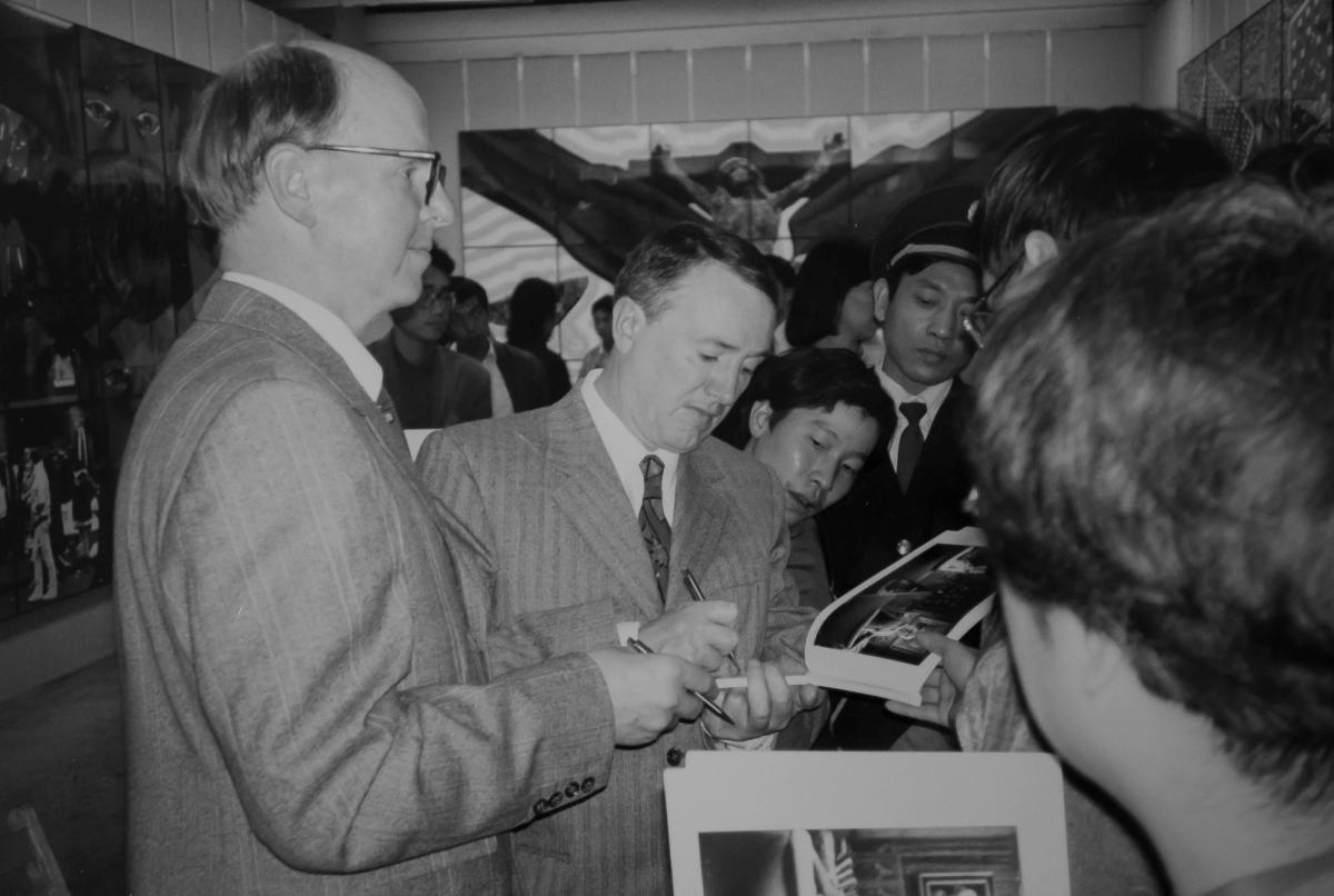 Gilbert & George being mobbed for catalogues in Beijing Courtesy of James Birch