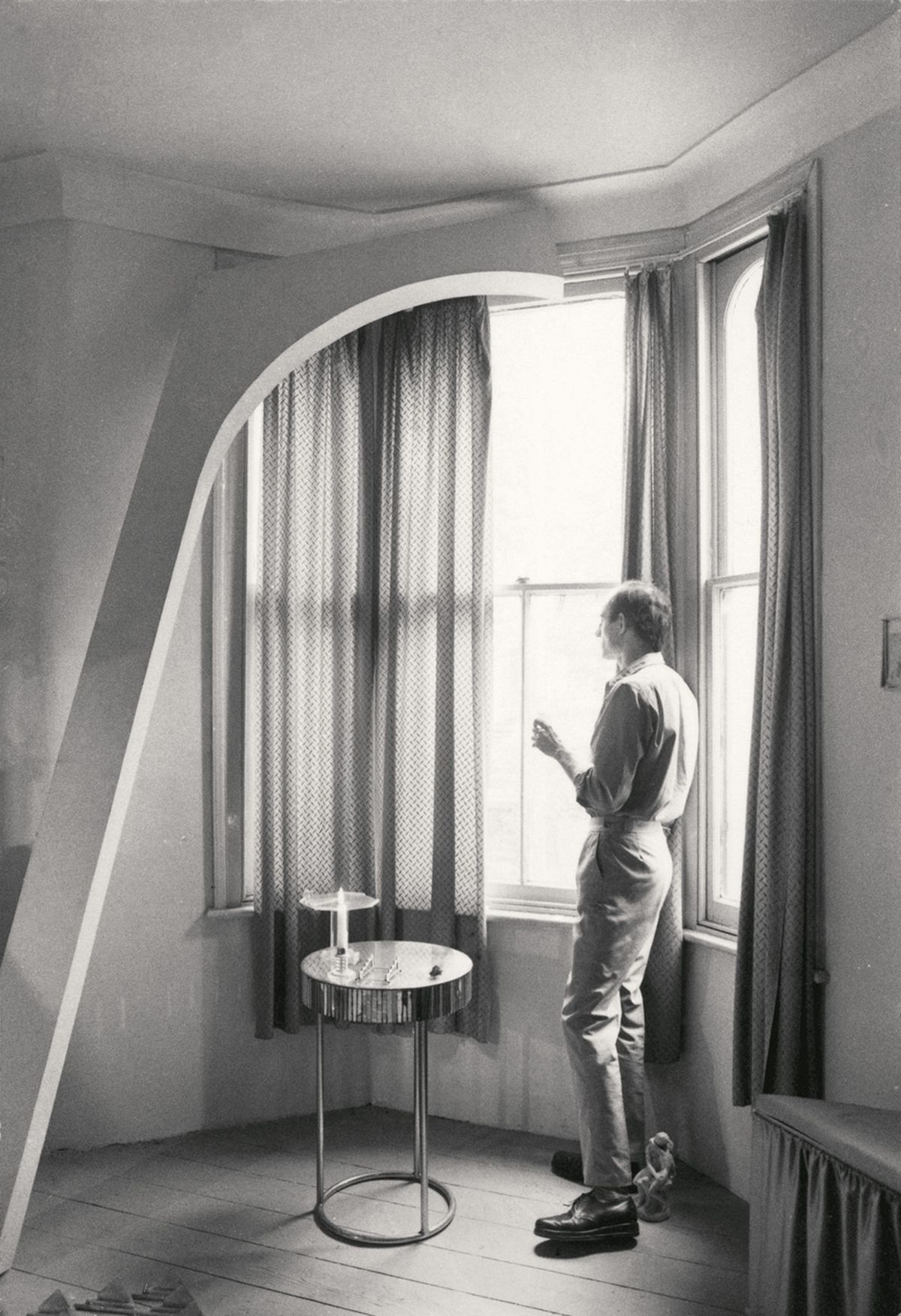 Marc Camille Chaimowicz, Man Looking Out of the Window (for SM) (around 1977). A portrait of the artist in his apartment on Approach Road, east London, a project he worked on from 1974 to 1979 Photograph: Courtesy the artist and Cabinet, London