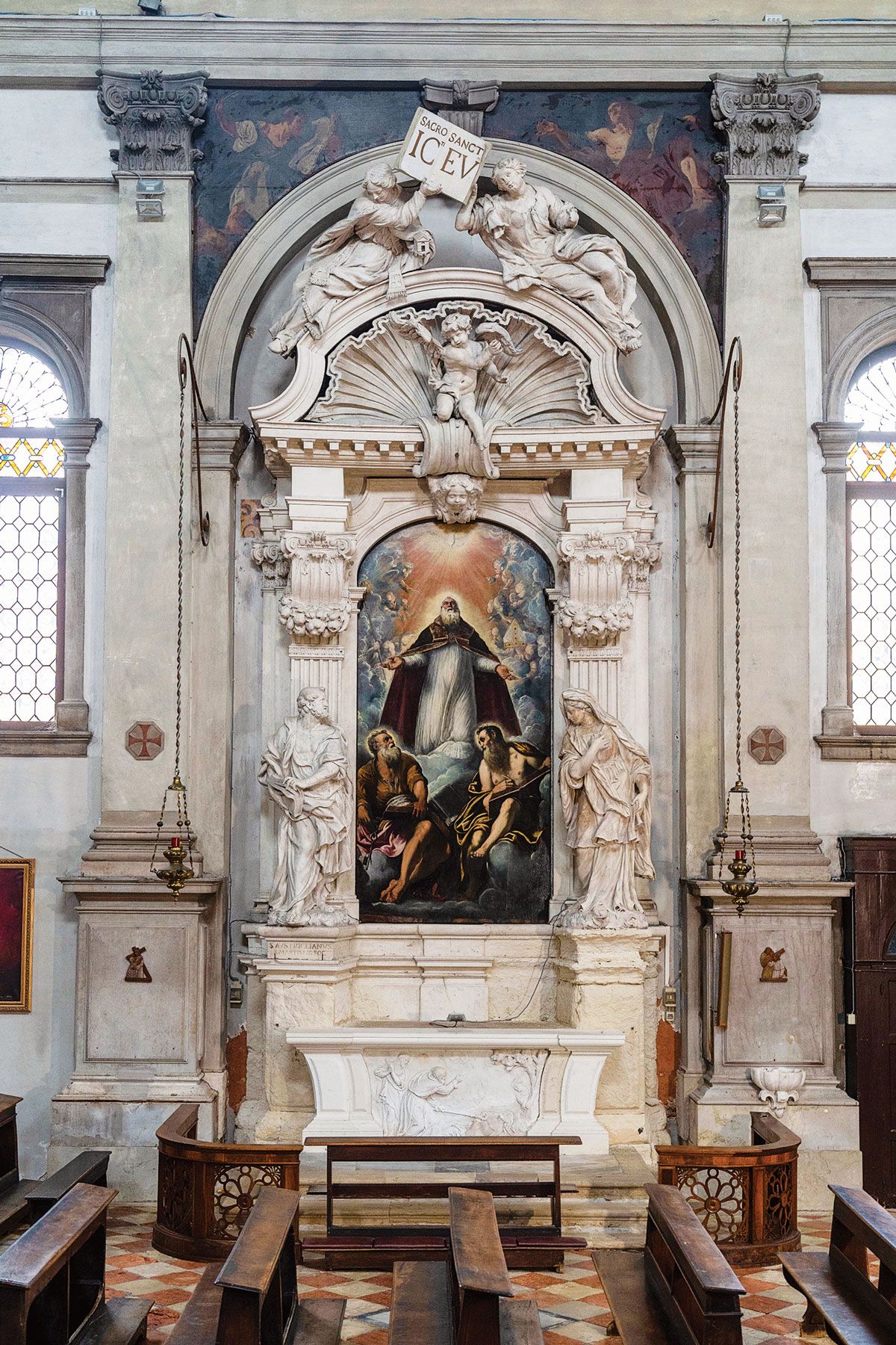Giulia Lama’s spandrel paintings of Saint Luke and Saint John at San Marziale church can be seen above Tintoretto’s Saint Martial in Glory with Saints Peter and Paul, an altarpiece restored by Save Venice in 2018 Photo: Matteo De Fina; courtesy of Save Venice