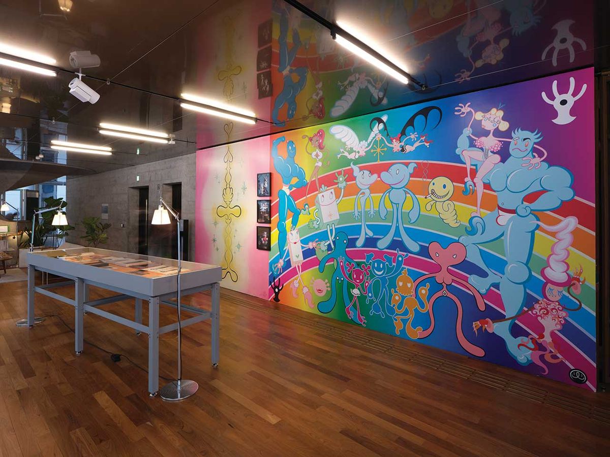 Installation view of Myth Makers—Spectrosynthesis III at Tai Kwun Contemporary, Hong Kong (unti 10 April), with a mural by the Japanese artist Maru Yacco
Photo: South Ho