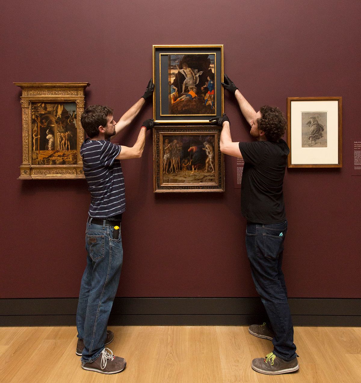 Andrea Mantegna’s painting The Resurrection of Christ being installed on 6 December above The Descent of Christ into Limbo (both around 1492) © The National Gallery, London