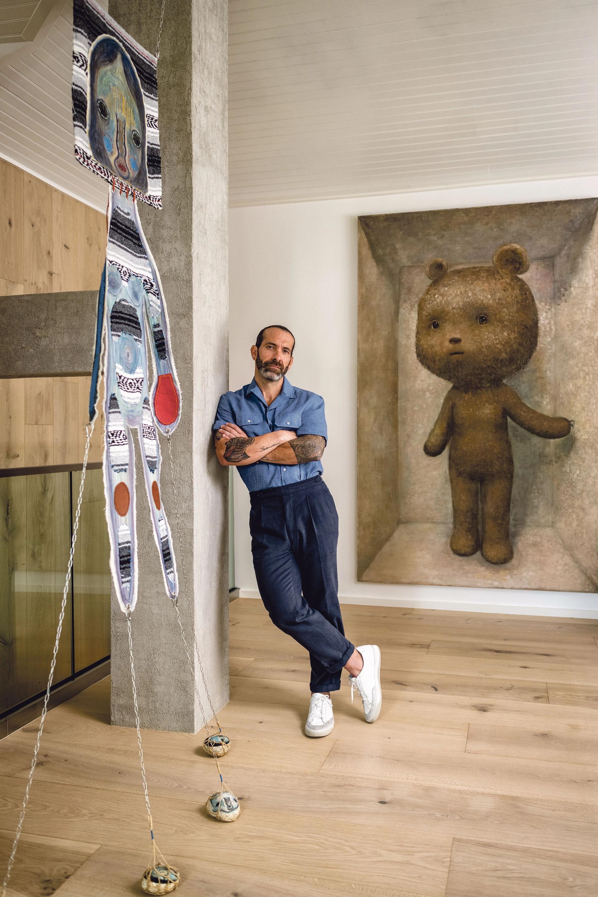 John Marquez with some of his art at home. Photo courtesy of John Marquez. © Nick Garcia