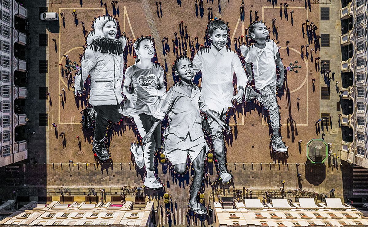 This image of JR's Déplacé.e.s (2023) procession in Turin is featured in a new book about the street artist JR and © Atelier JR