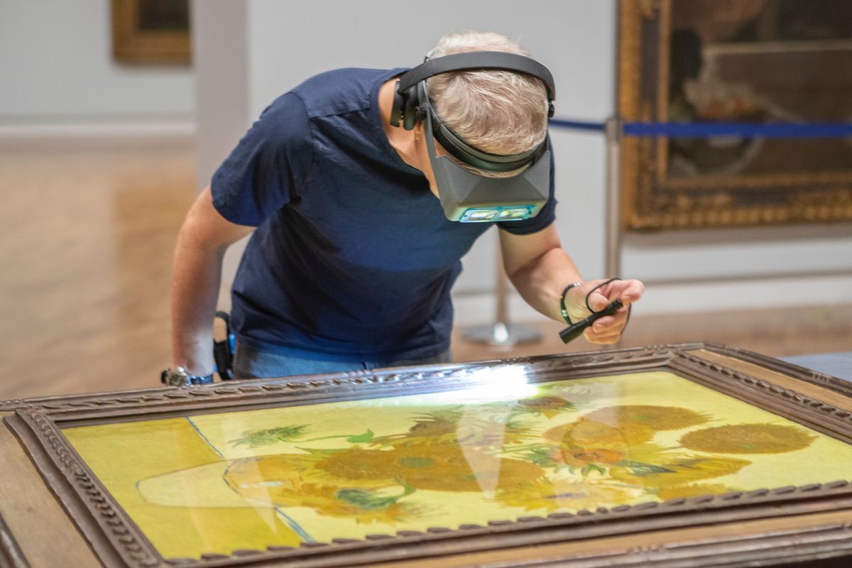Vincent van Gogh’s Sunflowers (1888) from London’s National Gallery being checked on its arrival at the National Gallery of Australia, Canberra Courtesy of National Gallery of Australia, Canberra